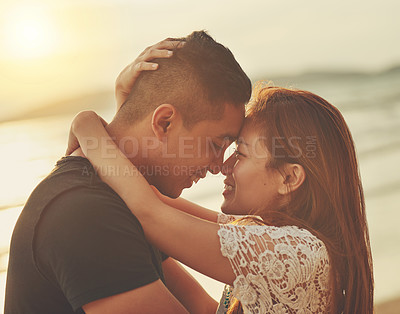 Buy stock photo Cropped shot of a young couple sharing an intimate moment