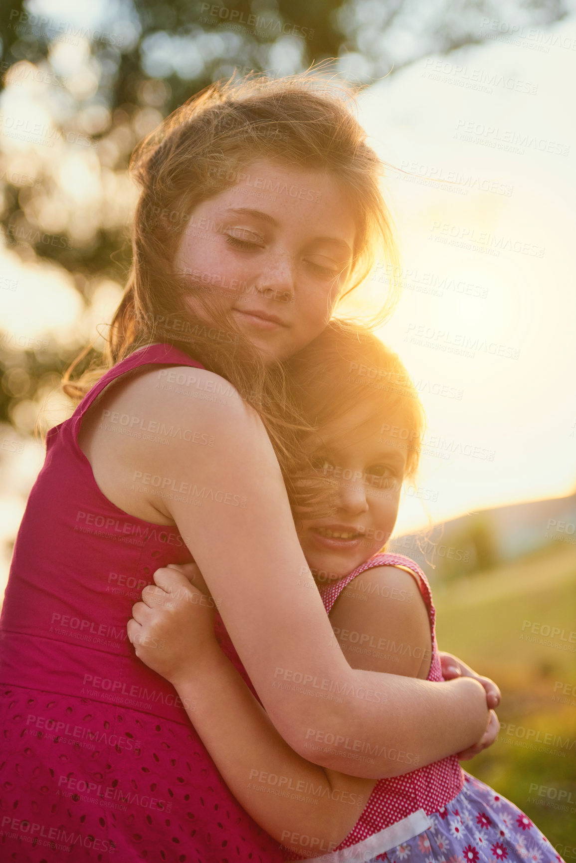 Buy stock photo Sisters, portrait and hug outdoor with happiness for summer,  holiday and support together as family. Girls, embrace and smile on field in garden with love for nature, vacation and fun as young kids