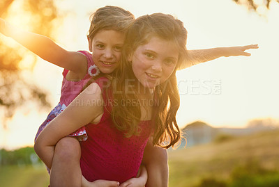 Buy stock photo Portrait of two cute sisters playing together in the park