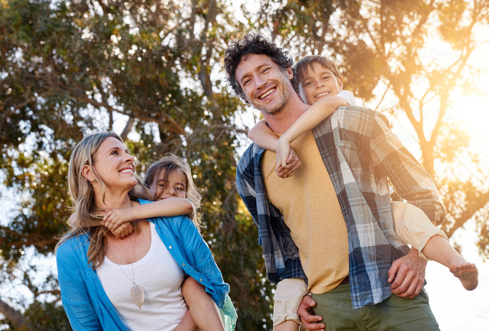 Buy stock photo Happy family, walking and piggyback for kids with parents in a park with love, games and fun bonding in nature. Support, playing and people in a forest for back ride, travel and trust on vacation