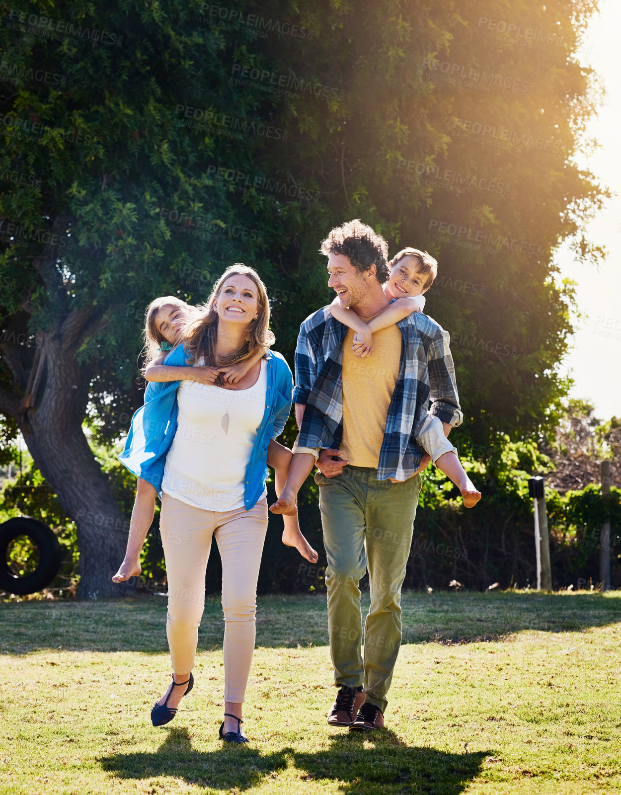 Buy stock photo Family, happy and piggyback in garden with playing for bonding, weekend fun and games in home with sunshine. Parents, kids and carry on back for summer, outdoor scenery and people on adventure