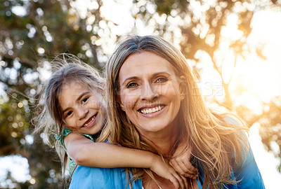 Buy stock photo Love, portrait or mother and daughter with piggyback hug in a park for fun, adventure and journey outdoor at sunset. Happy family, face and mom carrying girl in a forest with support, trust or games