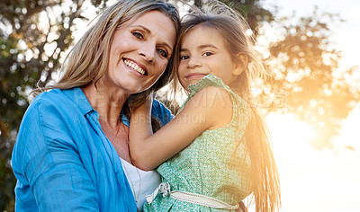 Buy stock photo Portrait of a happy mother and daughter spending time together outdoors