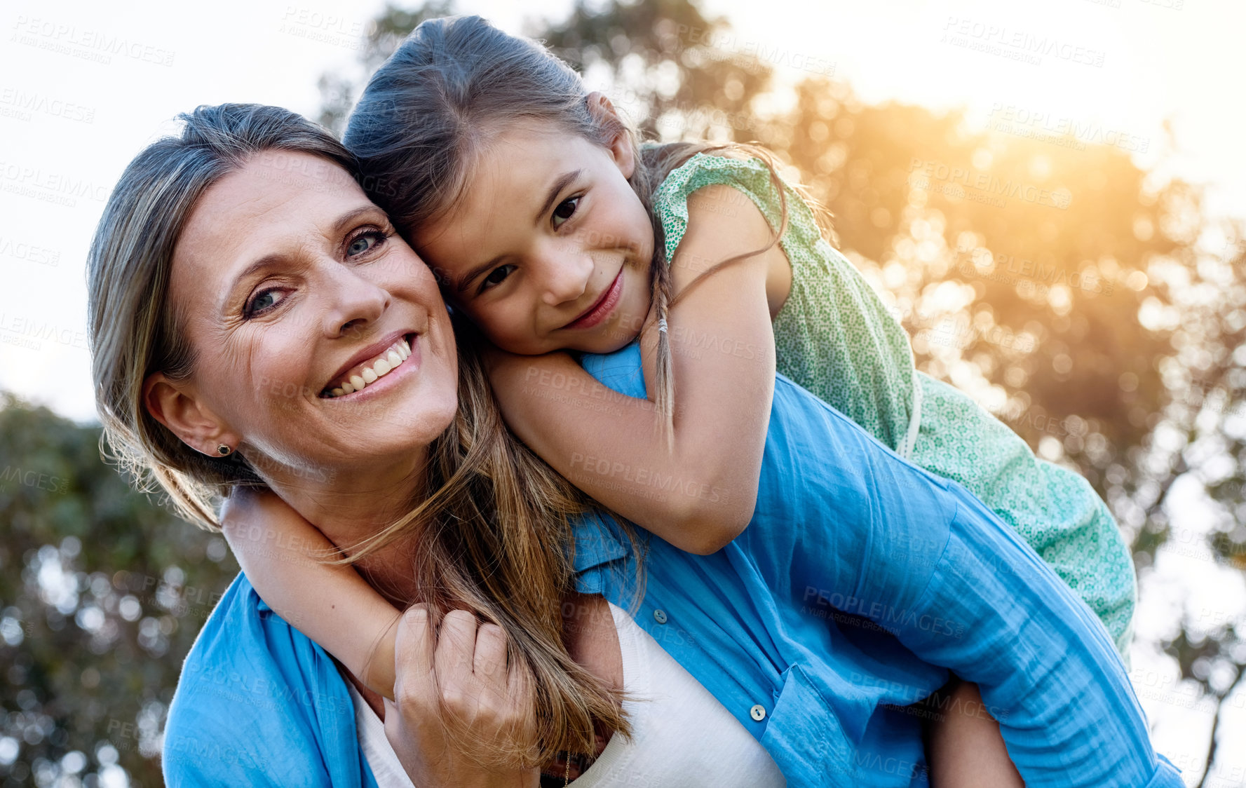 Buy stock photo Portrait, girl and woman with piggyback in backyard for support, care and holiday in countryside. Sunshine, family and child in garden with love for springtime, vacation and together in nature