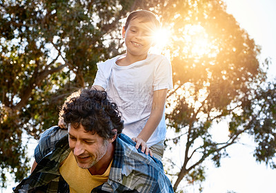 Buy stock photo Father, boy child and outdoor for piggy back with smile, bonding on vacation in Australia. Male person, kid and happiness for learning or development in nature, support with lens flare behind tree