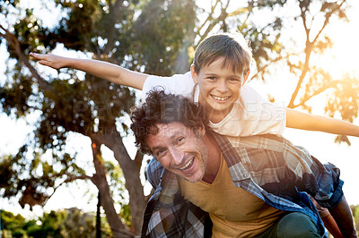 Buy stock photo Father, boy child and outdoor for piggy back with arms and smile, vacation in Australia with portrait. Male person, son and happy for game or playful in nature, support in summer and fun in England