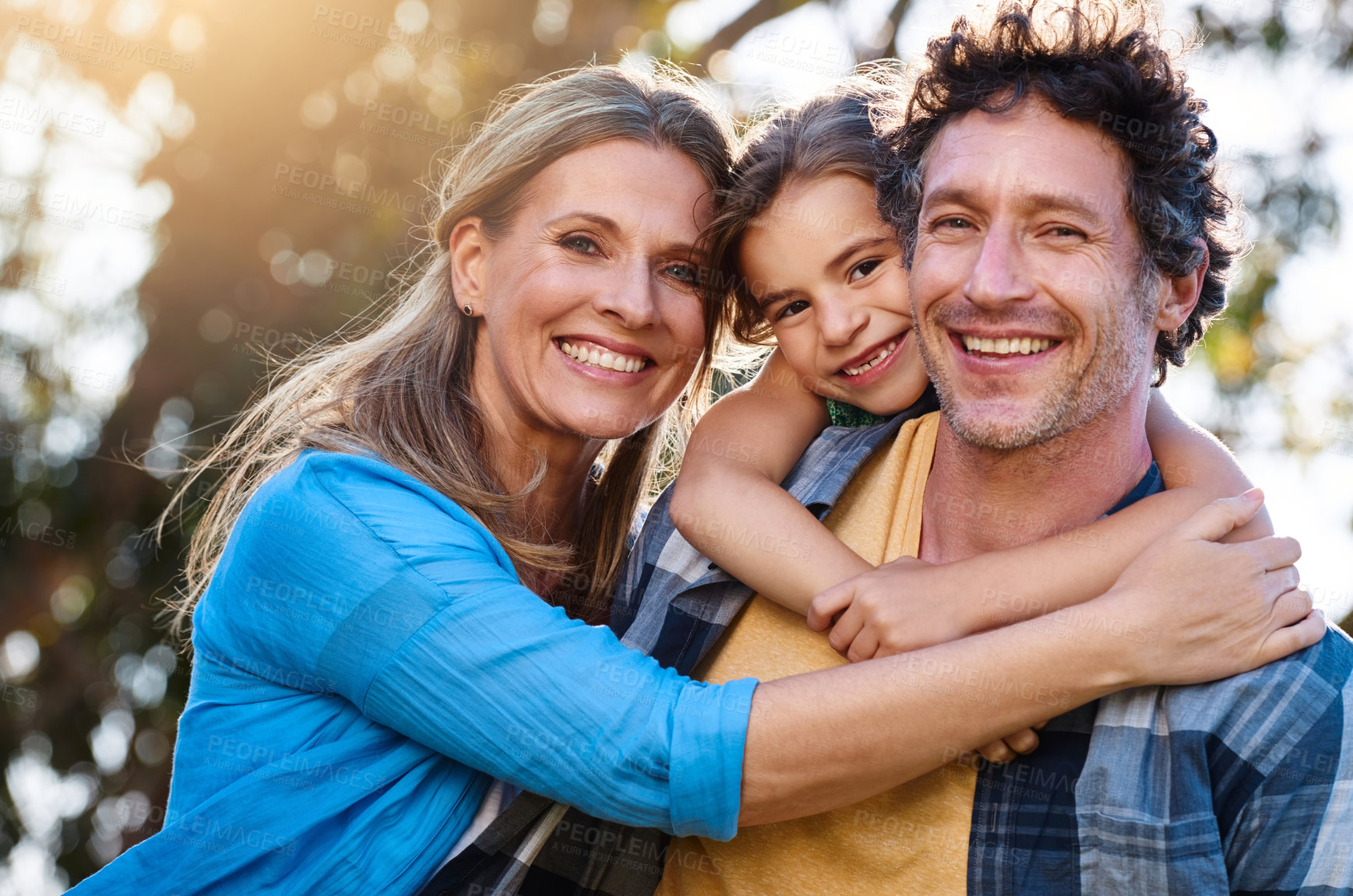 Buy stock photo Portrait of a happy family spending time together outdoors