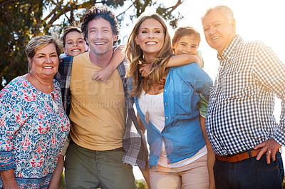 Buy stock photo Portrait of three generations of family spending time together outdoors