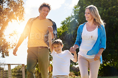 Buy stock photo Shot of a happy family spending time together outdoors