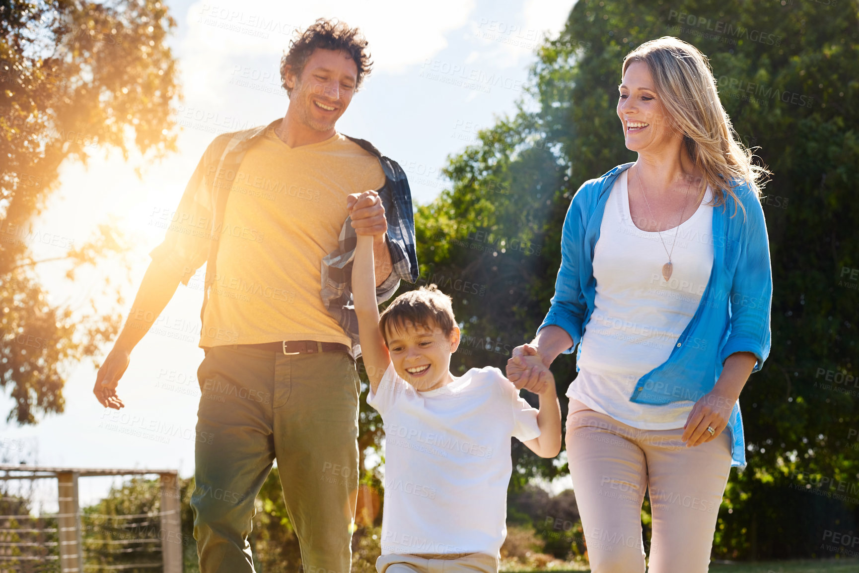 Buy stock photo Happy, family and kid with holding hands in nature for outdoor adventure, vacation and support. Man, woman and son with love at countryside for holiday, child development and bonding on fathers day