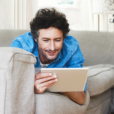 Buy stock photo Man, comfort and tablet internet on couch for digital contact, social media or movie app. Male person, streaming film and online shop connection or connectivity fun for relaxing, weekend joy on sofa