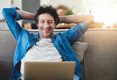 Buy stock photo Stretching, relax and happy man on laptop in home living room, wellness or smile with reading email online. Peace of mind, computer or person on sofa for calm, zen or freelancer on social media break