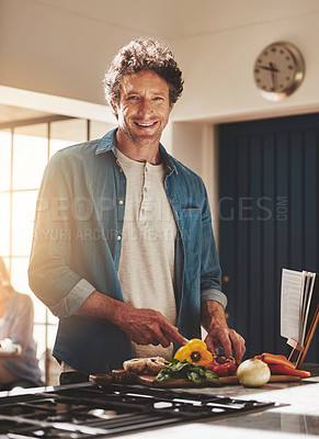 Buy stock photo Smile, portrait and man chop vegetables in the kitchen for diet, healthy or nutrition dinner. Happy, cooking and mature male person from Canada cutting ingredients for a supper or lunch meal at home.