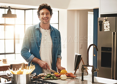 Buy stock photo Happy, portrait and man cutting vegetables in the kitchen for diet, healthy or nutrition dinner. Smile, cooking and mature male person from Canada chop ingredients for a supper or lunch meal at home.