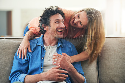 Buy stock photo Shot of a happy mature couple having a relaxed day together at home