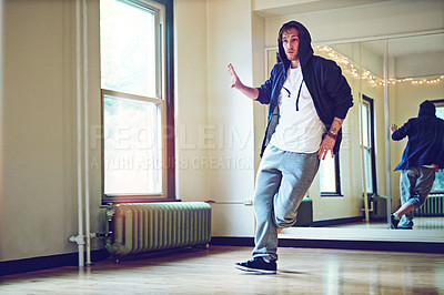 Buy stock photo Dance, hip hop and man in studio with practice for concert, recital or performance at creative school. Art, music and dancer moving to song, playlist or radio for rehearsal with energy and rhythm.