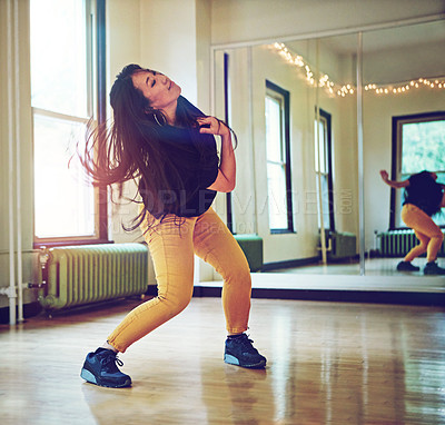 Buy stock photo Woman, dancing and studio with hip hop for performance and alone, mirror with reflection and workout. Female dancer, practice and class with glass for exercise, moving with freedom in New York City