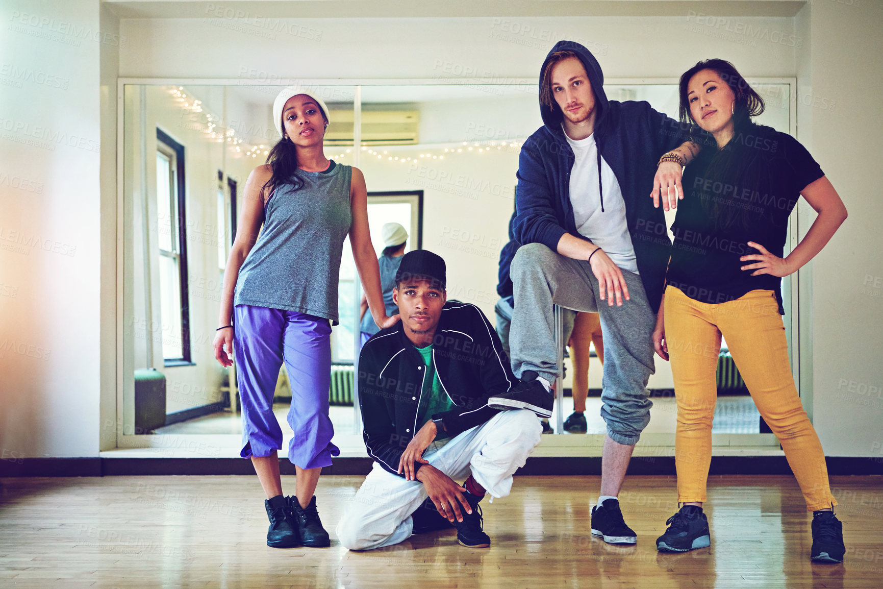 Buy stock photo Shot of a group of young friends hanging out in a dance studio