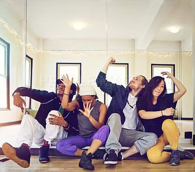 Buy stock photo Shot of a group of young friends hanging out in a dance studio