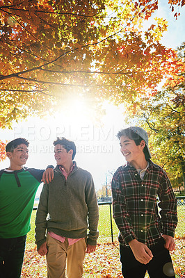 Buy stock photo Happy, boys or friends in park together for summer holiday, break or trust and support. Smiling, social or group of teenagers walking in forest for talking, connection and outdoor adventure in sun