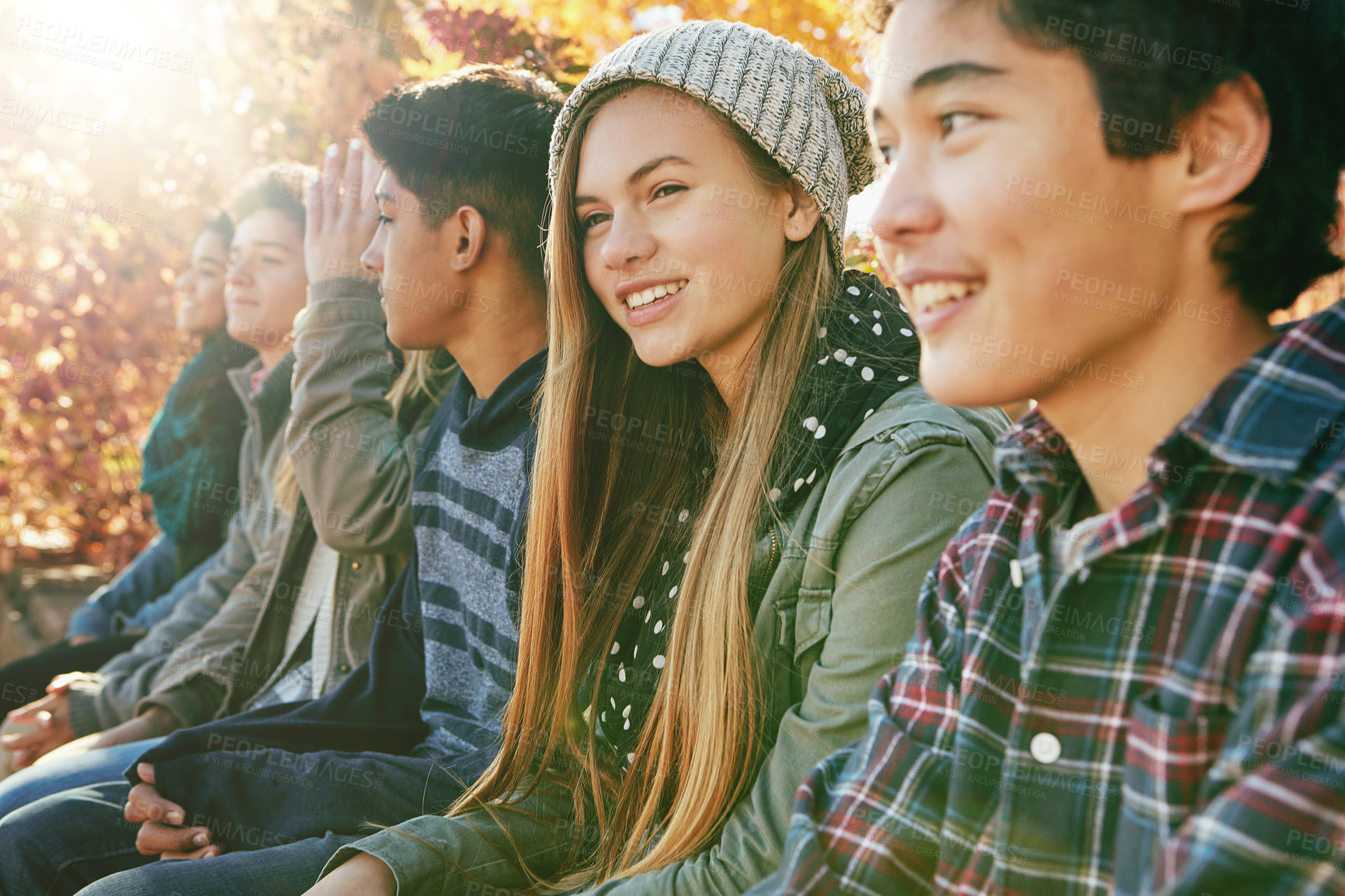 Buy stock photo Smile, row and friends outdoor in park for relaxing day on summer vacation of semester break, together and happiness. Group, teenagers and trees in garden on holiday in New Zealand and bonding.