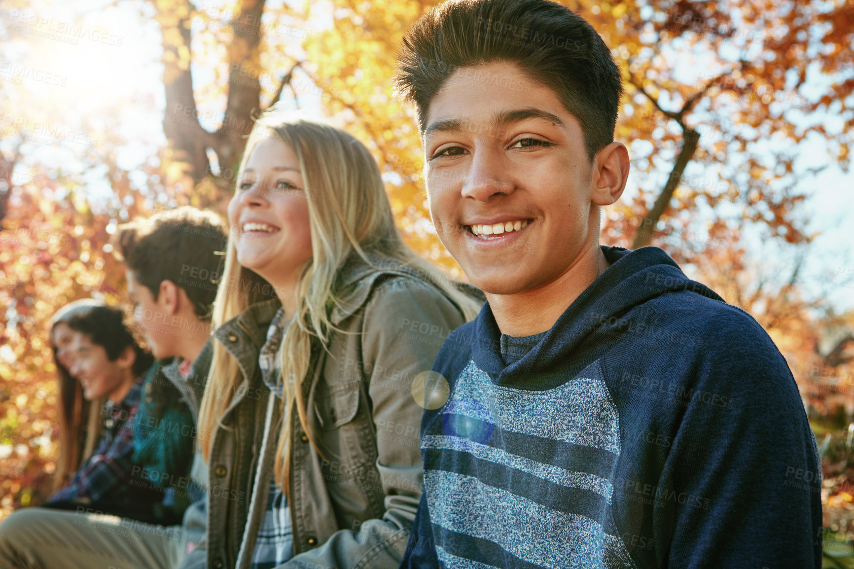 Buy stock photo Teenager, friends and portrait in outdoor, boy and diversity on holiday, nature and relax by trees. Youth culture, happy group and gen z school kids in sunshine, woods or park for vacation in Canada
