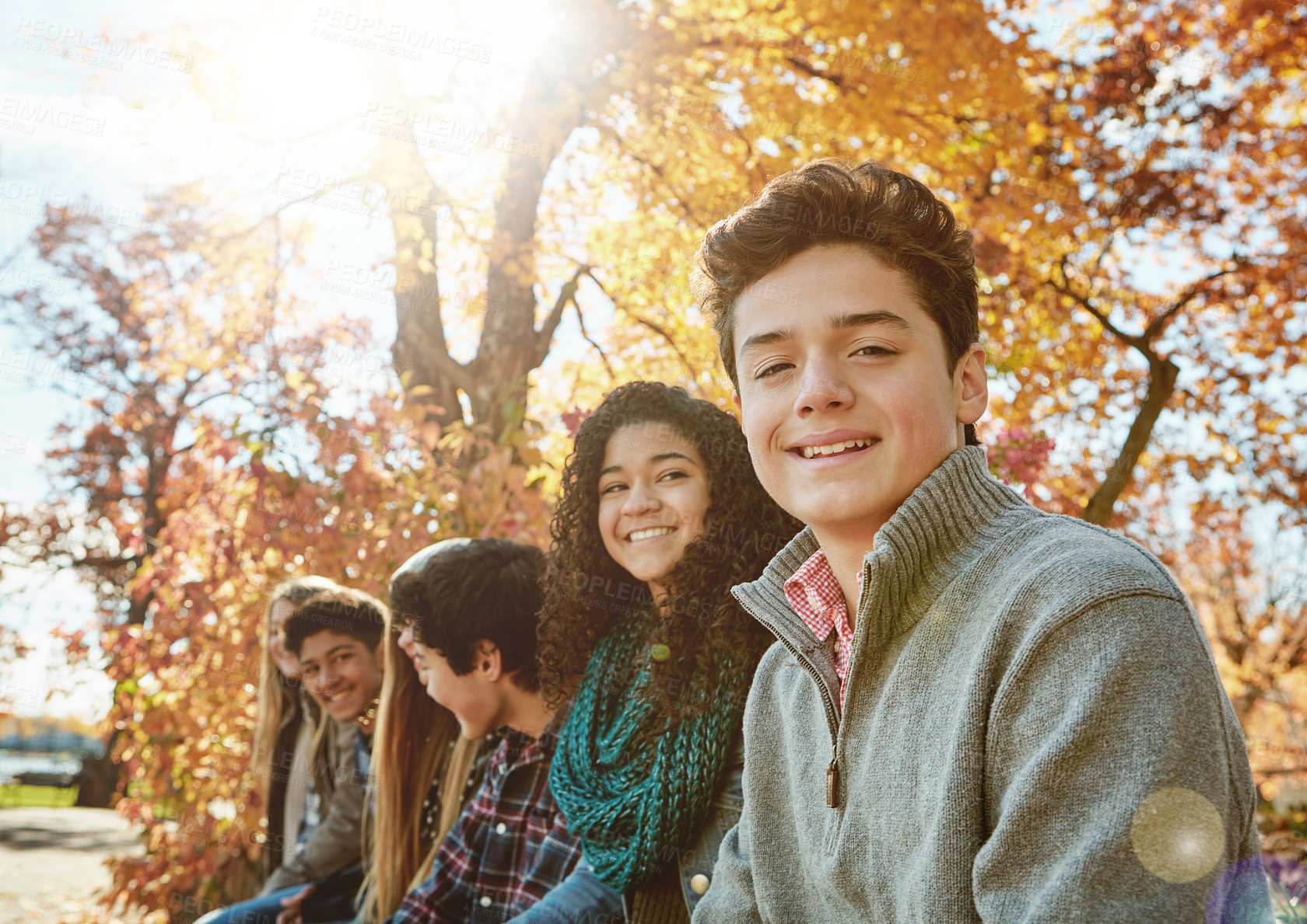 Buy stock photo Boy, friends and nature with relax or teen with casual, trees in park with smile. Group, people and young in portrait or happy with diversity in garden for friendship, youth or wellness in Canada