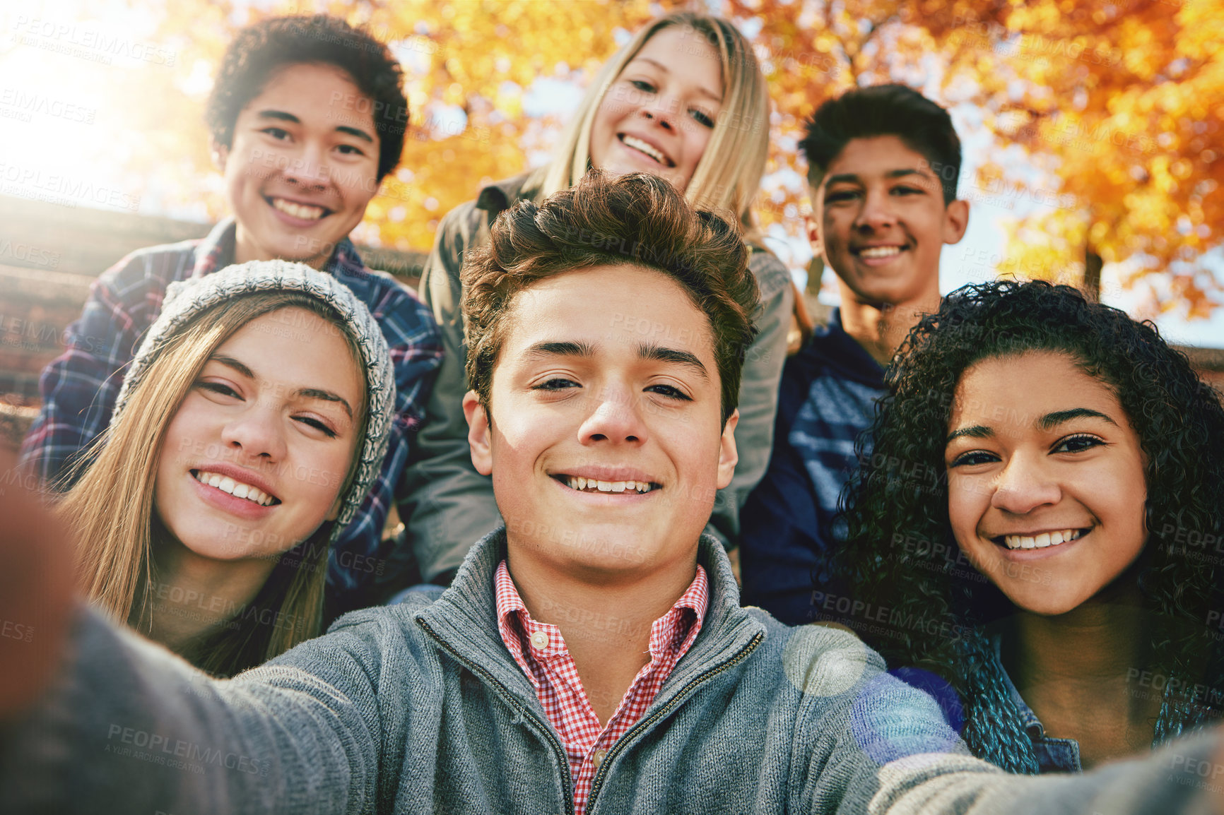 Buy stock photo Selfie, teenager and group of friends in park, nature or fall trees and teens smile, picture of friendship and happiness for social media. Portrait, face and happy people together for autumn photo