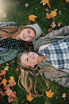 Buy stock photo Top view, friends or girls on park for lying, relaxing and bonding together on grass with happiness. Nature, lawn or teenagers on holiday for chilling, hanging out or laugh outdoors with smile