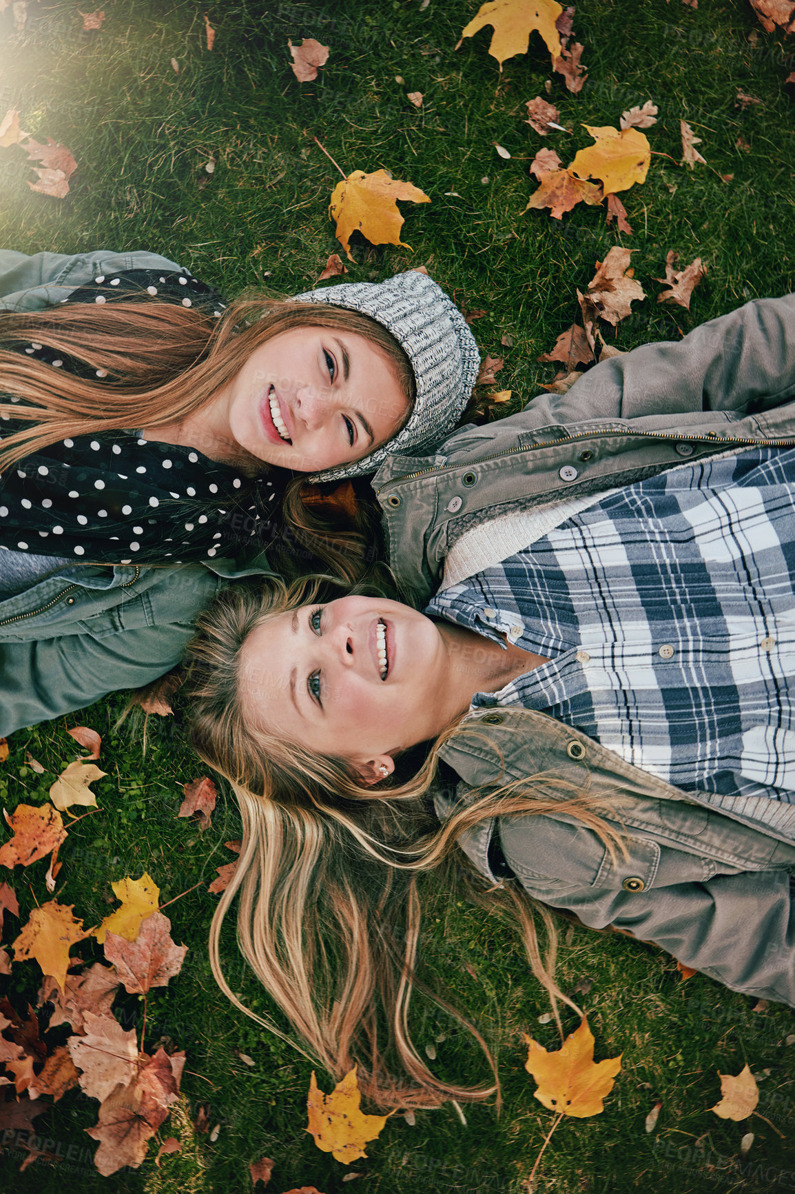 Buy stock photo Top view, friends or girls on park for lying, relaxing and bonding together on grass with happiness. Nature, lawn or teenagers on holiday for chilling, hanging out or laugh outdoors with smile