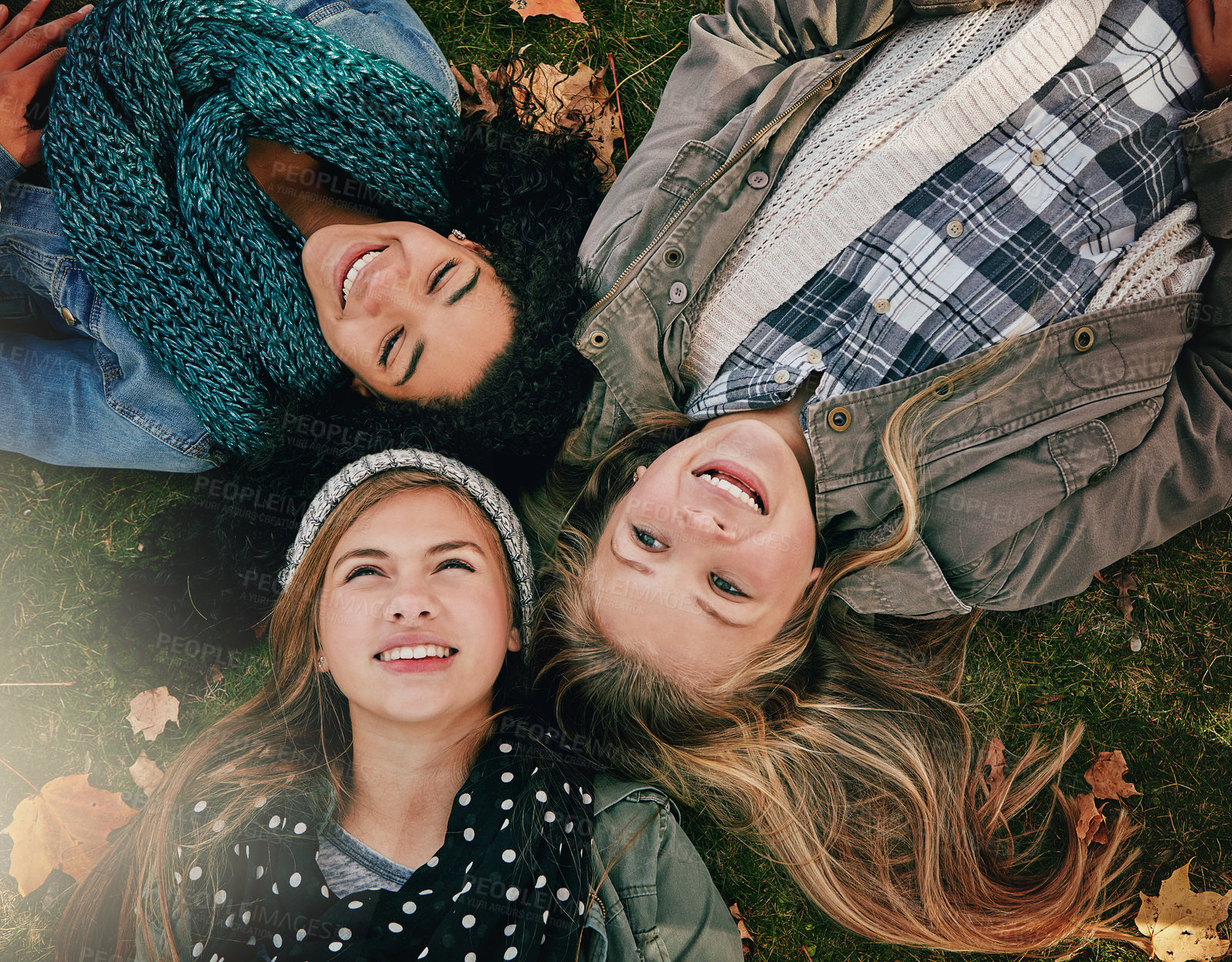 Buy stock photo Top view, teen girls and grass for lying, relaxing and bonding together in park with happiness. Nature, lawn and friends on summer holiday for chilling, hanging out and laugh outdoors with smile