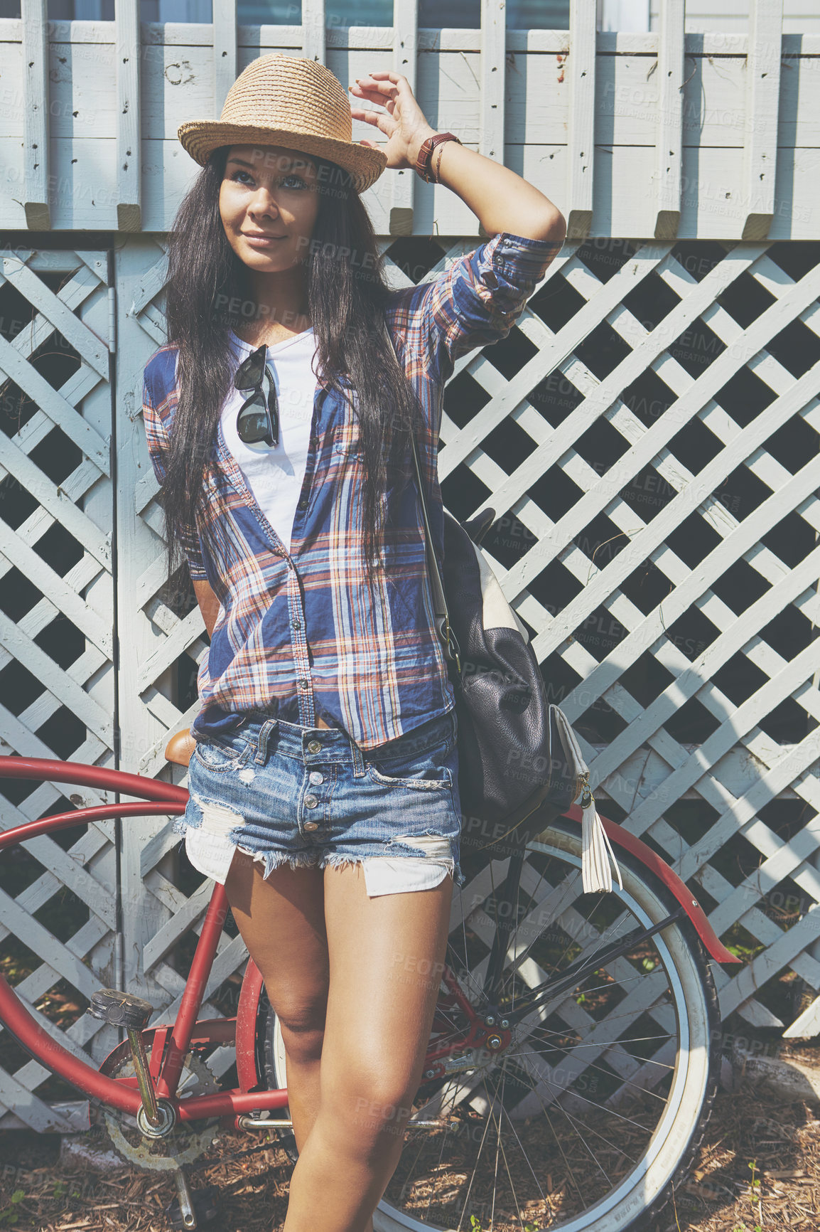 Buy stock photo Shot of a beautiful young woman riding her bike in the park