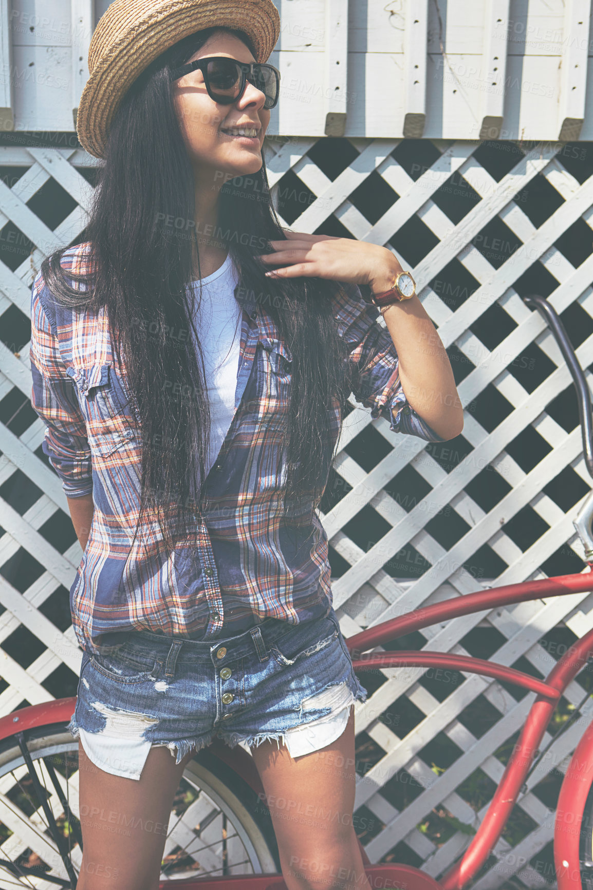 Buy stock photo Shot of a beautiful young woman riding her bike in the park