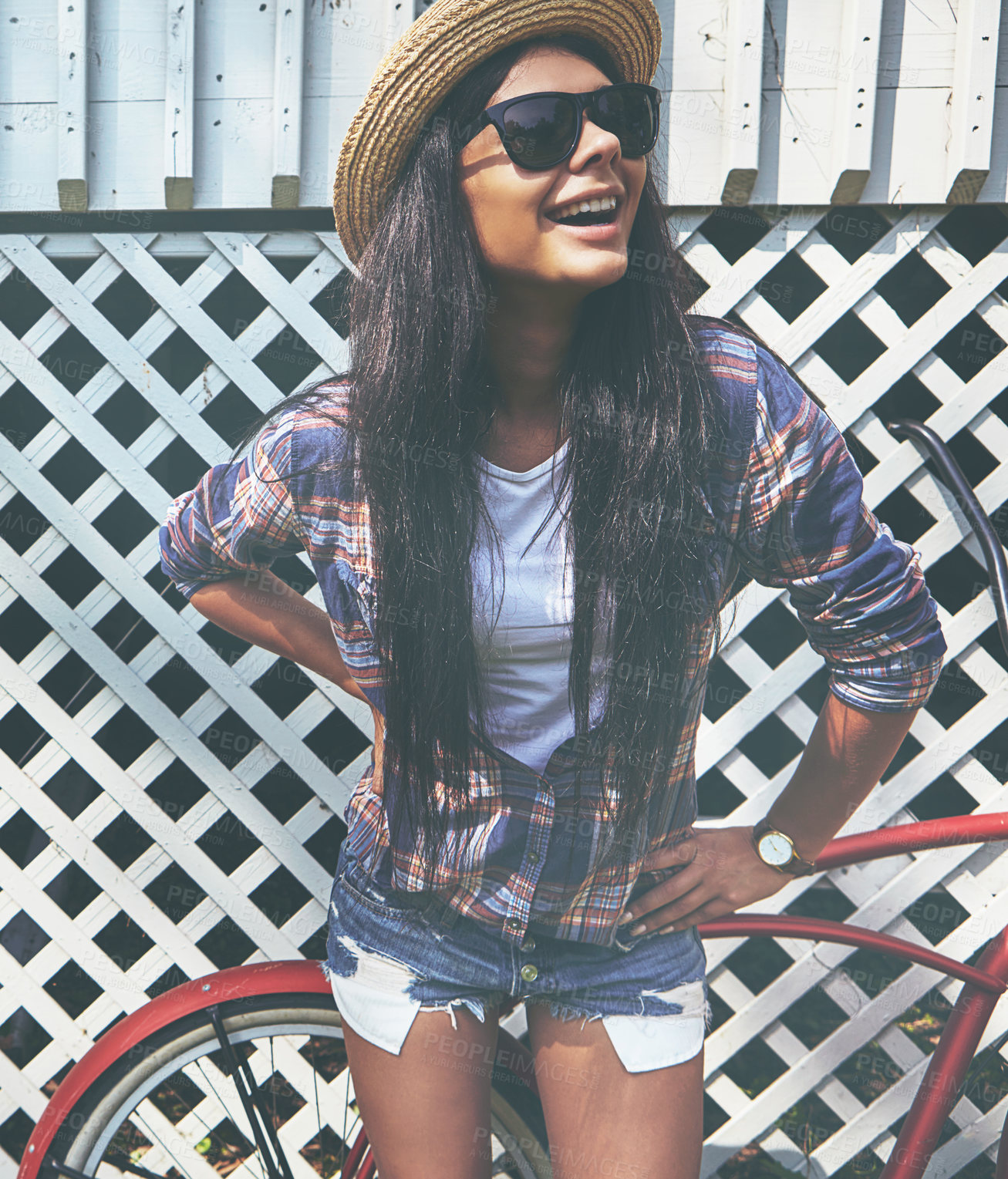 Buy stock photo Shot of a beautiful young woman riding her bike in the park