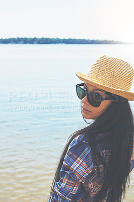 Buy stock photo Shot of an attractive young woman enjoying a day on the beach