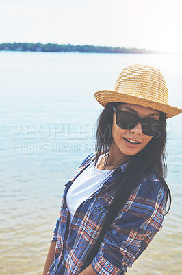 Buy stock photo Shot of an attractive young woman enjoying a day on the beach