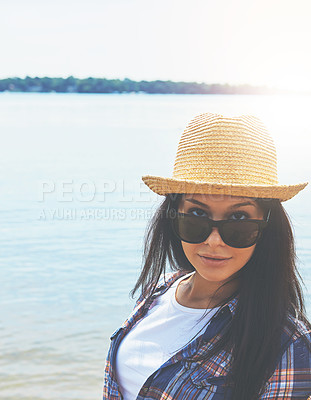 Buy stock photo Shot of an attractive young woman enjoying a day on the beach