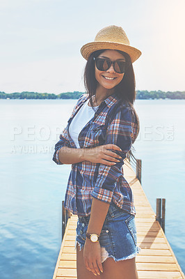 Buy stock photo Shot of an attractive young woman enjoying a day on the beach