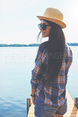 Buy stock photo Shot of an attractive young woman enjoying a day on the beach