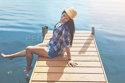 Buy stock photo Shot of an attractive young woman enjoying a day on the beach