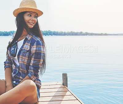 Buy stock photo Shot of an attractive young woman enjoying a day on the beach