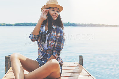 Buy stock photo Shot of an attractive young woman enjoying a day on the beach