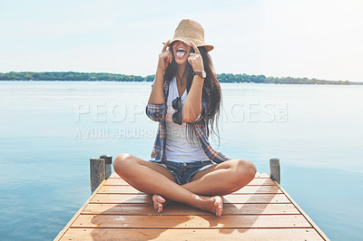 Buy stock photo Shot of an attractive young woman enjoying a day on the beach