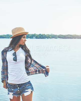 Buy stock photo Shot of an attractive young woman enjoying a day on the beach