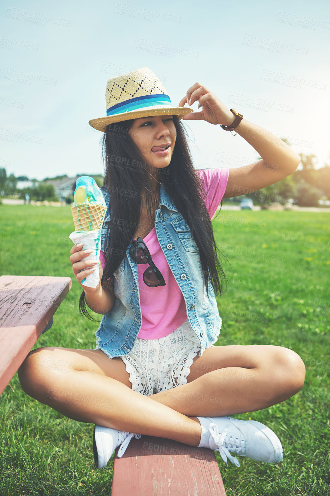 Buy stock photo Girl, looking and ice cream cone at park sitting on bench with vanilla or bubblegum flavor for summer. Woman, happy and gelato dessert at garden with sunshine or smile for relax, vacation and nature