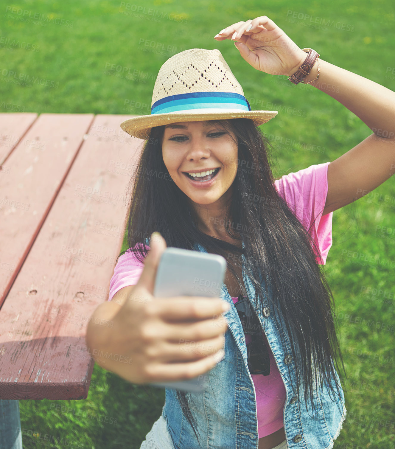 Buy stock photo Happy, girl and selfie on bench in park for profile picture on social media or memory of summer vacation in California. Woman, sunshine and holiday with photography or pose with hat and relax. 