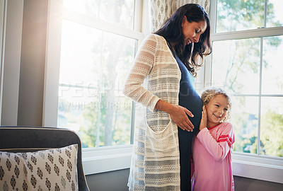 Buy stock photo Pregnant, mother and daughter with listening to tummy for baby kick, excited for newborn and curious with smile in home. Woman, pregnancy and happy girl with ear on stomach for bonding, care and love