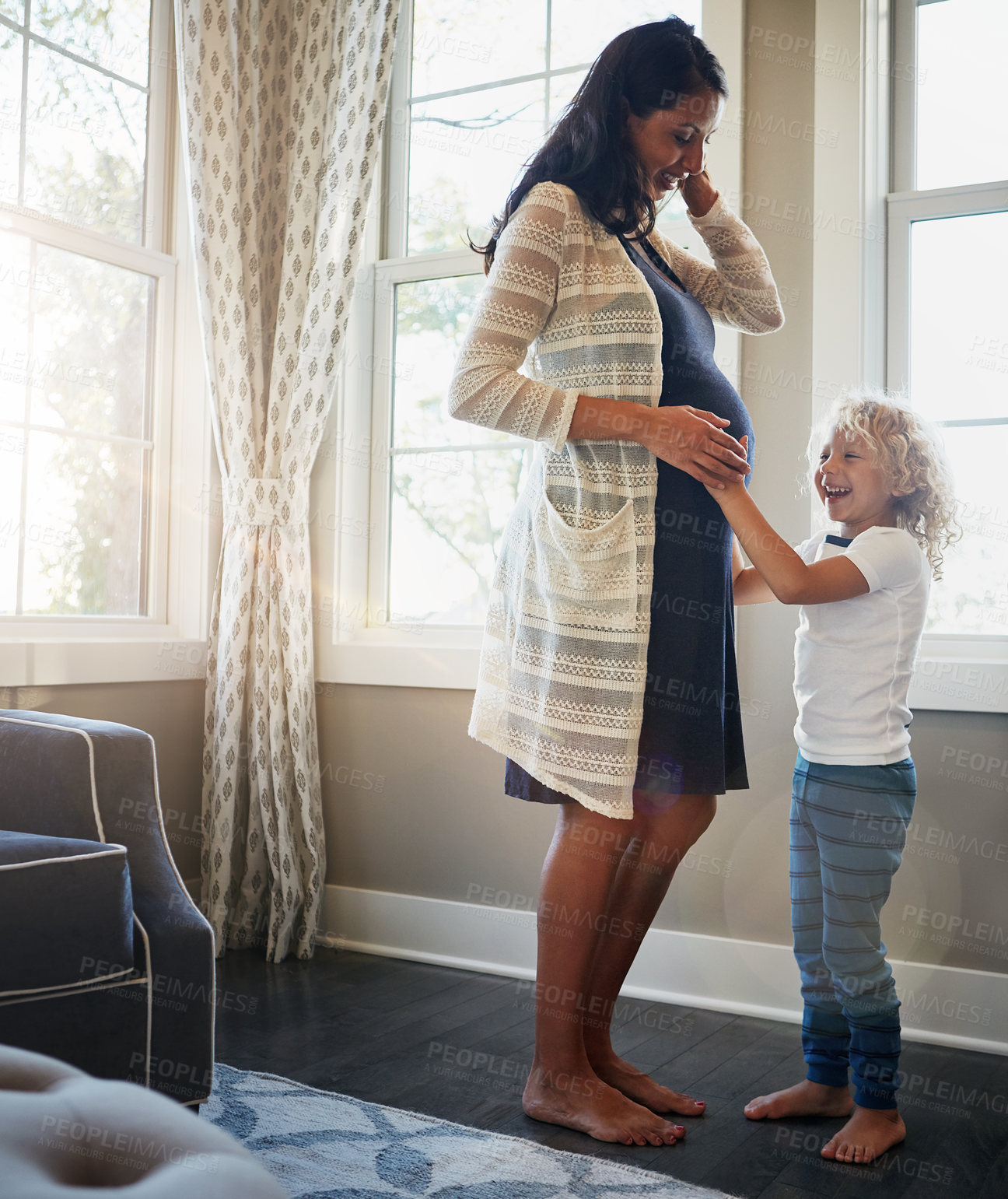 Buy stock photo Pregnant, mother or child with touch stomach in home for baby kick, relationship or bonding. Pregnancy, woman or curious son with fetus connection in house for prenatal support or excited for sibling