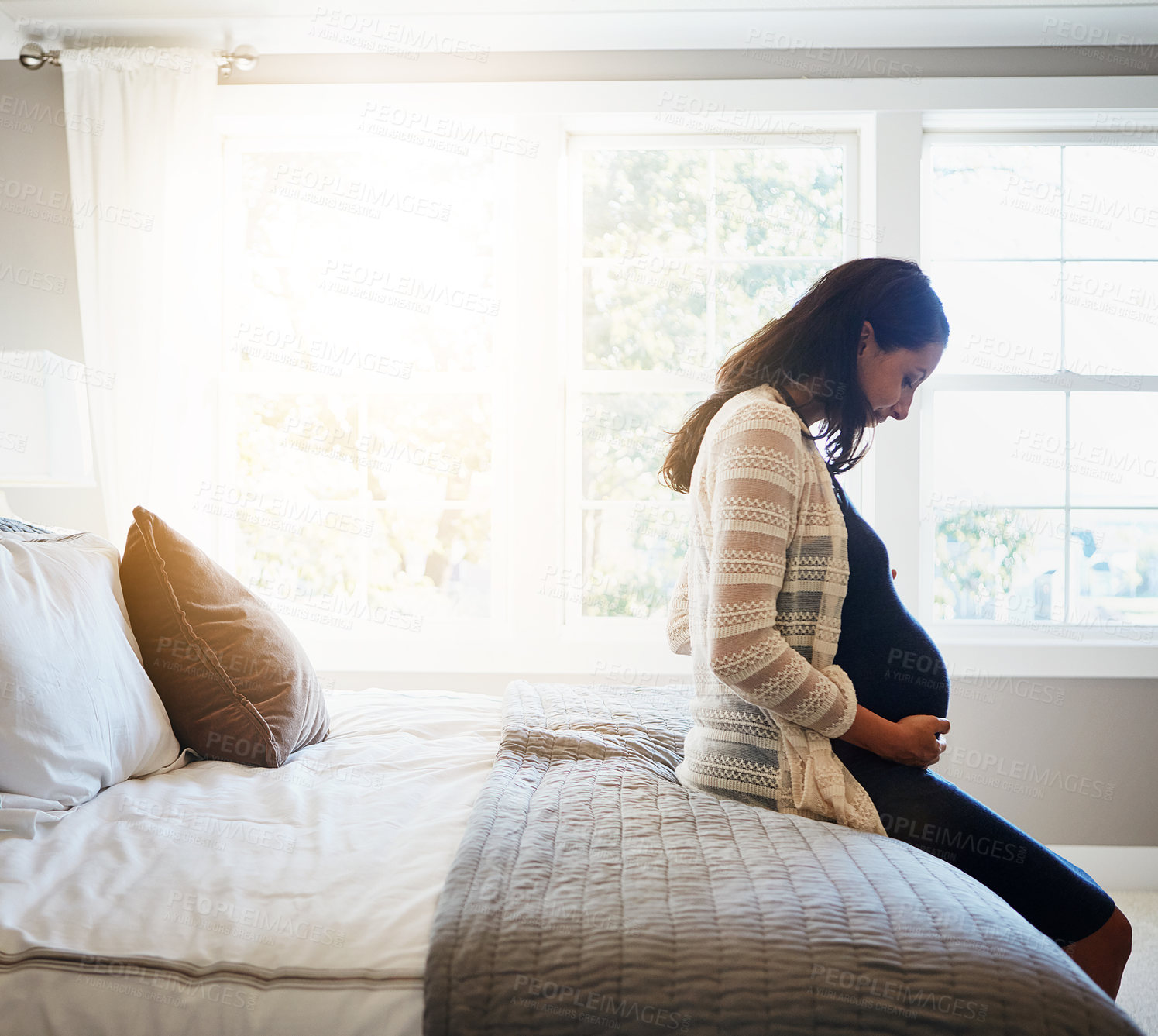 Buy stock photo Home, excited and pregnant woman with sunshine, relax and rest with fertility, stomach and belly. Person, bedroom and girl with pregnancy, motherhood and joy with maternity leave, wellness and health