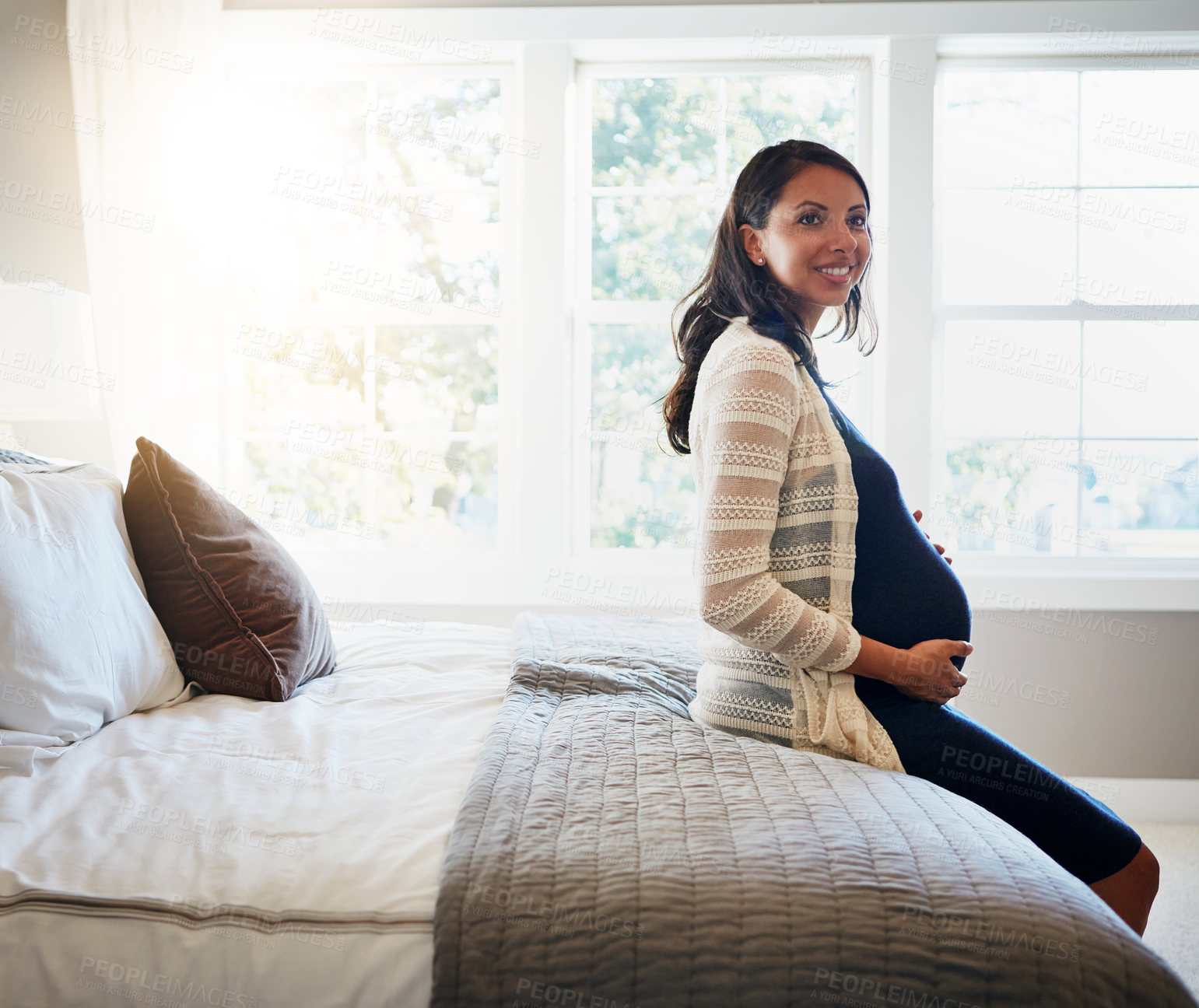 Buy stock photo Home bedroom, happiness and woman pregnancy, massage stomach, abdomen or mom happy for baby development. Mama expectation, bed and pregnant mother smile, maternity and hope for future life growth